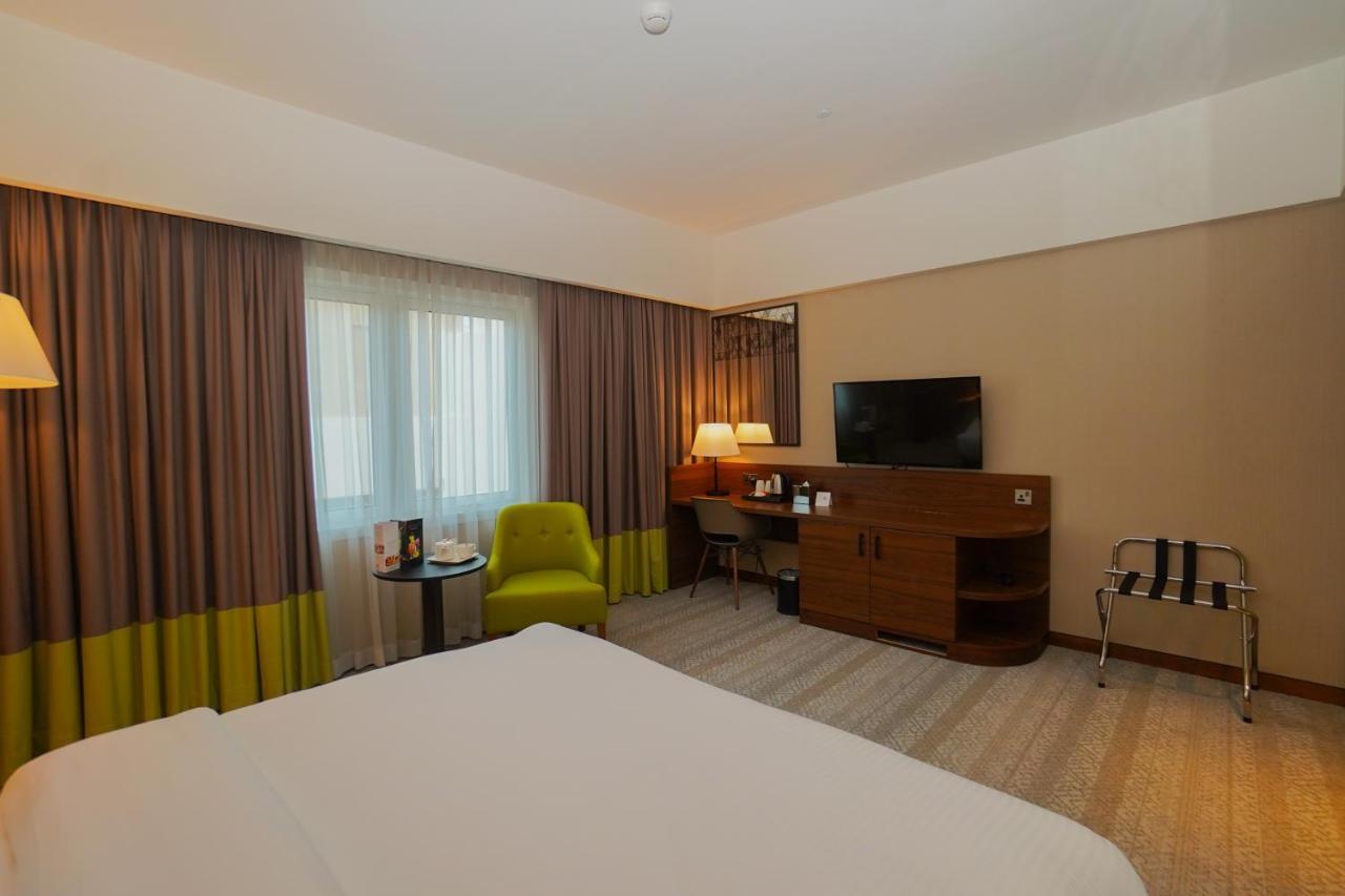 The Grand Lux Hotel Doha Exterior photo A room at the hotel