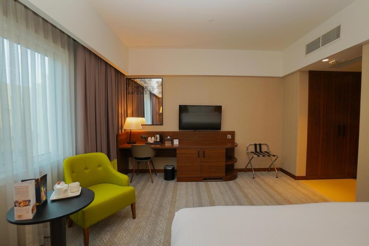 The Grand Lux Hotel Doha Exterior photo A room at the hotel