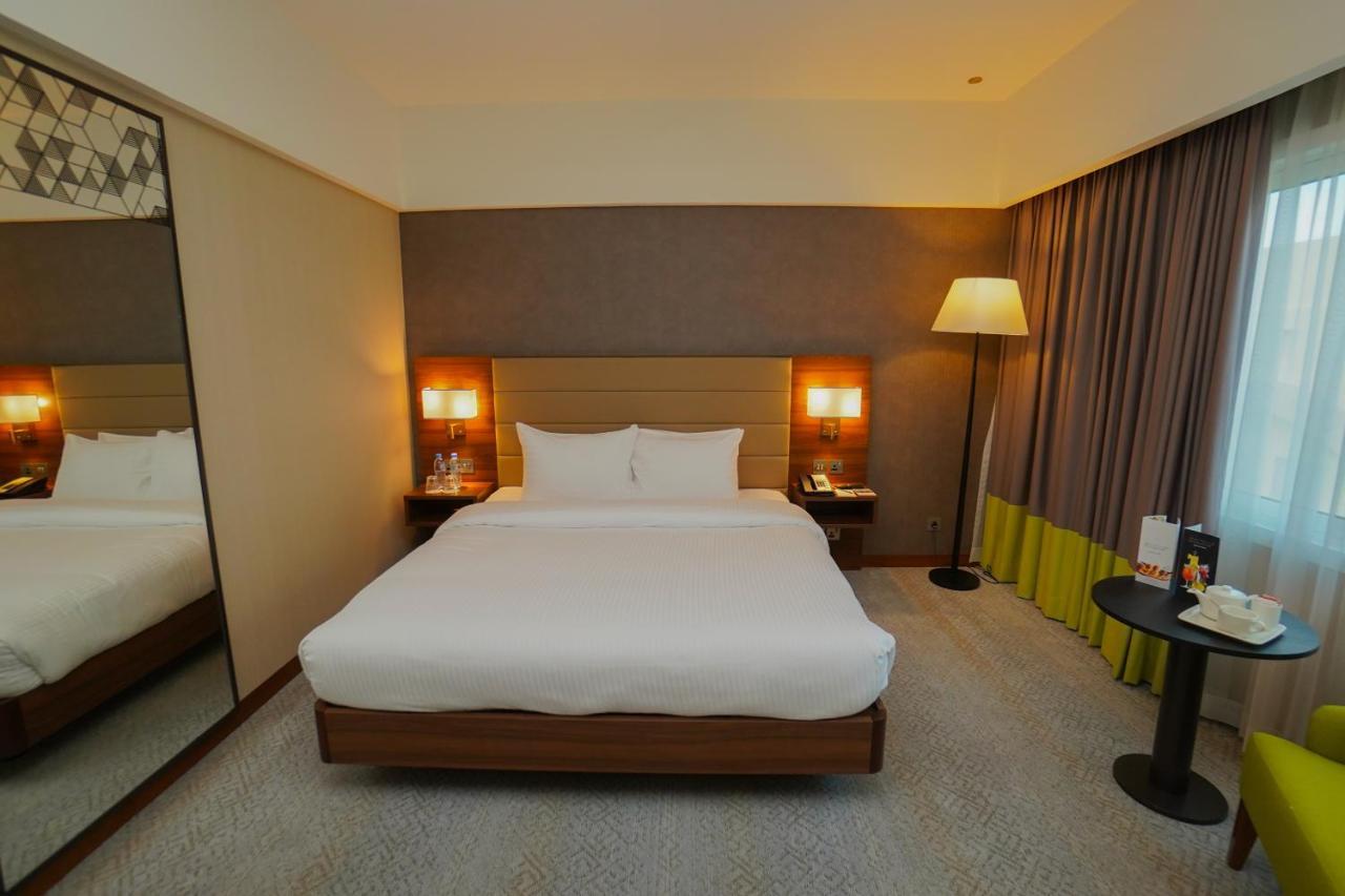The Grand Lux Hotel Doha Exterior photo A room at the hotel