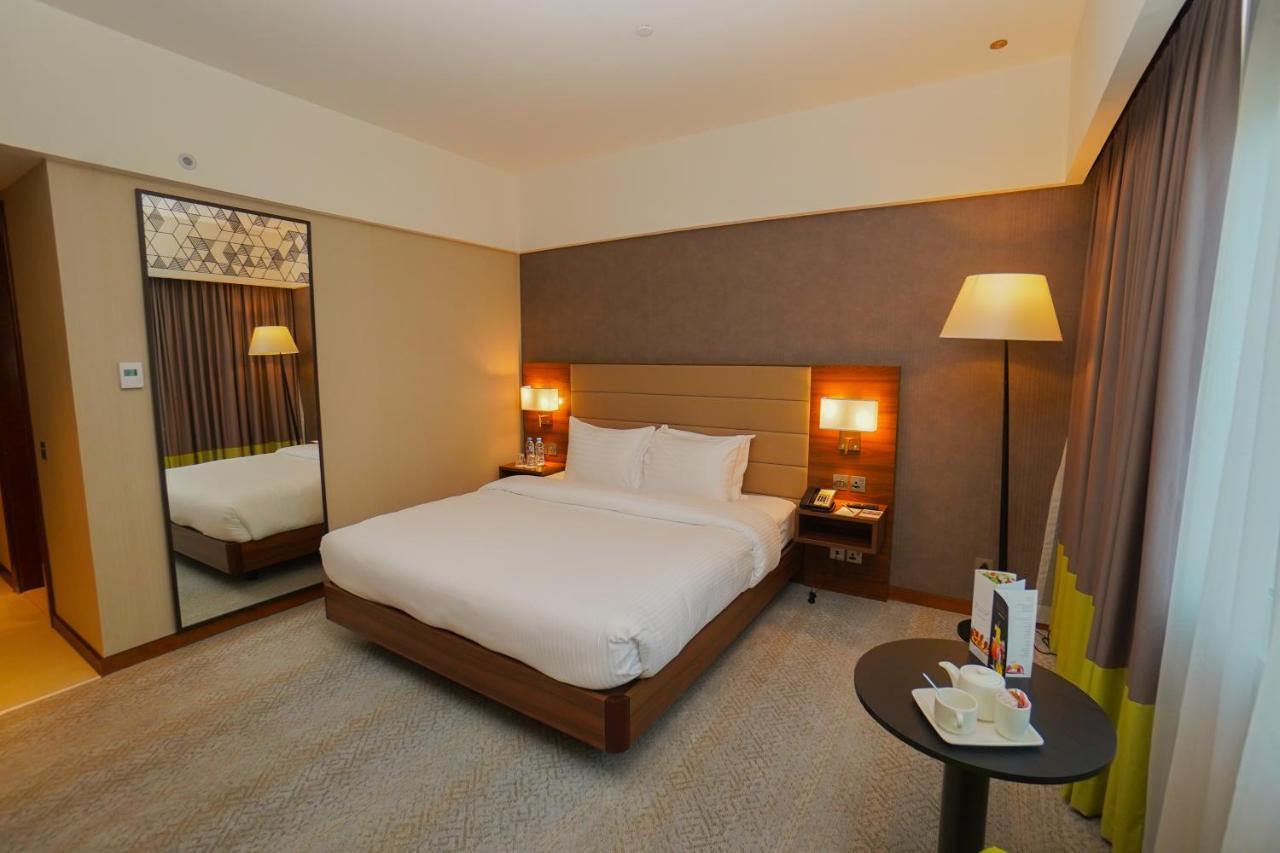 The Grand Lux Hotel Doha Exterior photo A room at the hotel