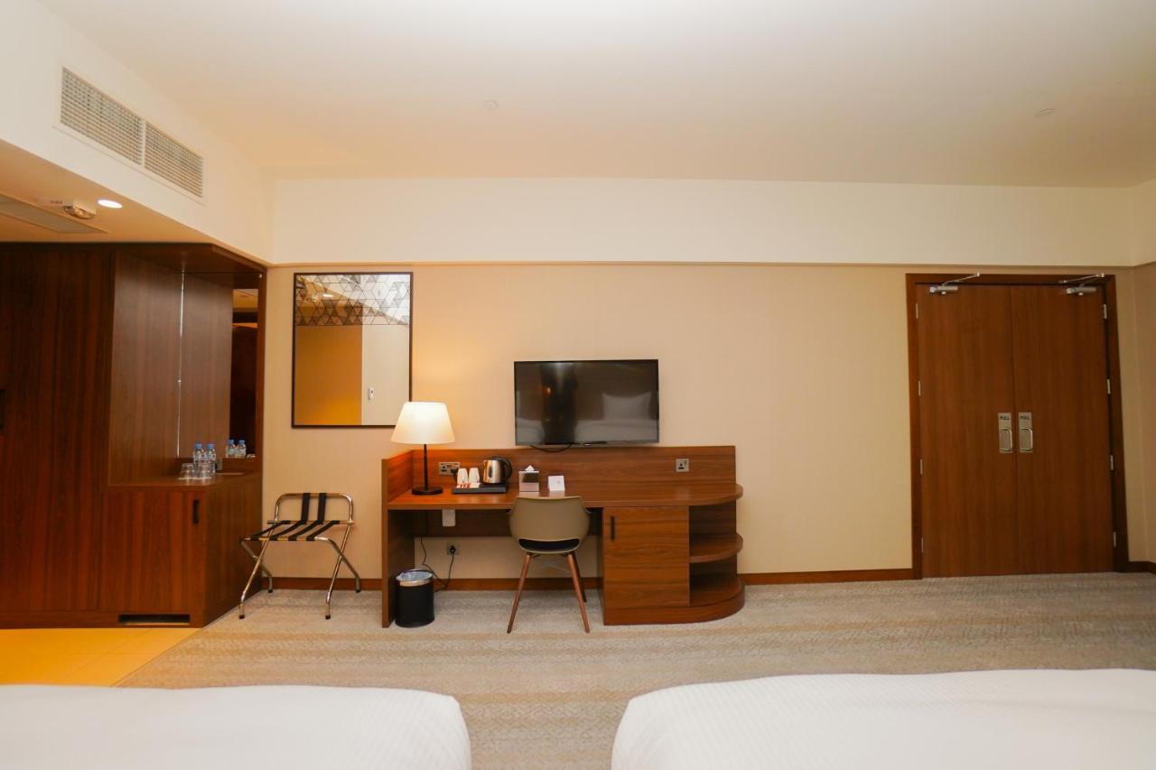 The Grand Lux Hotel Doha Exterior photo A room at the hotel