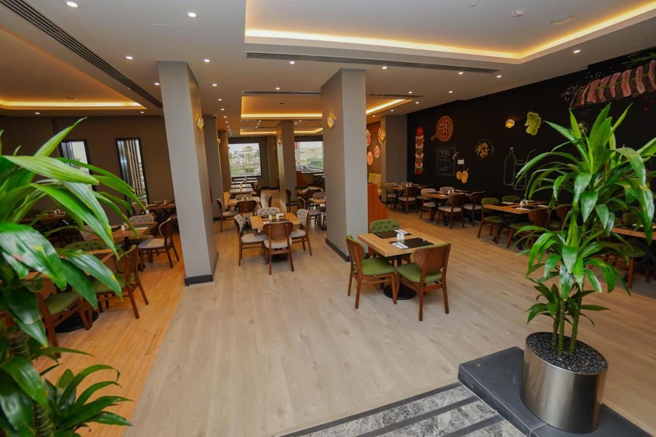 The Grand Lux Hotel Doha Exterior photo Restaurant