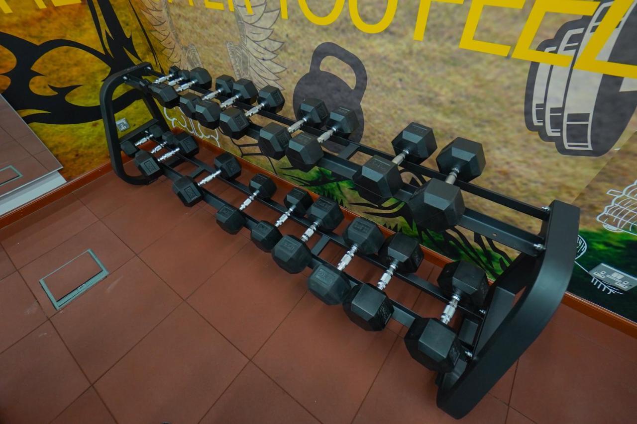 The Grand Lux Hotel Doha Exterior photo Dumbbell rack
